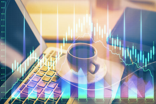 Financial graph colorful drawing and table with computer on background. Double exposure. Concept of international markets.
