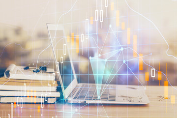 Forex market chart hologram and personal computer background. Multi exposure. Concept of investment.