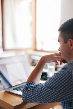 Man working with laptop at home