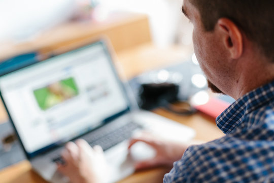 Man working with laptop at home
