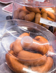 smoked sausages in refrigerated case