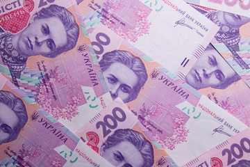 Ukrainian money. Hryvnia paper bill. Notes in denominations of two hundred hryvna. Uah. Cash. Background texture.