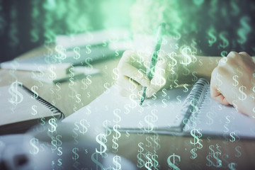 Financial forex graph drawn over hands taking notes background. Concept of research. Multi exposure