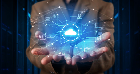 Man holding hologram projection displaying cloud technology symbols