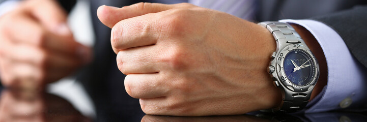 Fototapeta premium Man in suit and tie check out time at