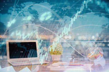 Forex graph hologram on table with computer background. Double exposure. Concept of financial markets.