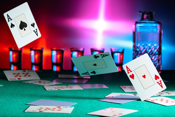 Cards fall on a casino table . Concept of gambling.