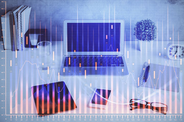 Financial chart drawing and table with computer on background. Multi exposure. Concept of international markets.