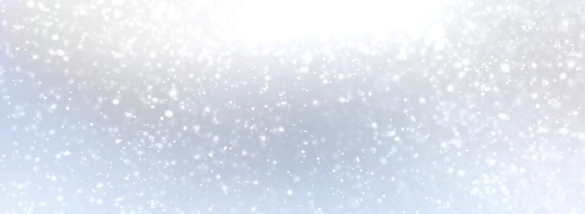 Fototapeta premium White snow on light blue shade background. Silver bright shine abstract banner. Blurred pattern. Subtle abstract texture. Winter outdoor illustration.