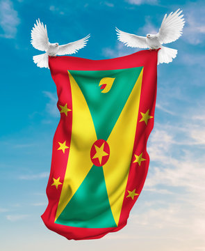 Grenada flag carried by white pigeon with sky background