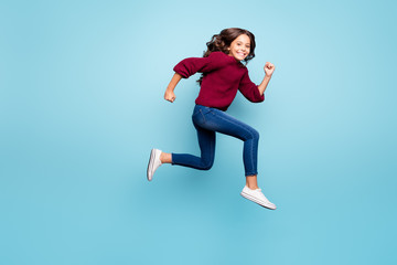 Fototapeta na wymiar Full length body size side profile photo of wavy cheerful positive girl running towards shopping center footwear isolated over vibrant color blue background