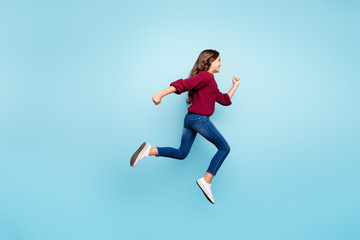 Fototapeta na wymiar Full length body size view of her she nice attractive lovely cheerful cheery active wavy-haired girl jumping running fast isolated on bright vivid shine vibrant green turquoise color background