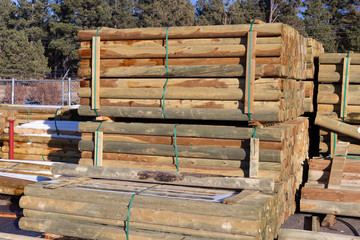 Wood fence posts for sale at farm and ranch store
