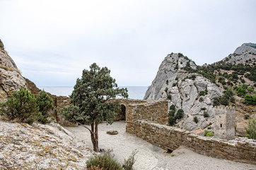 Mountain landscape, a small chapel by the mountain by the sea. View from the old fortress.