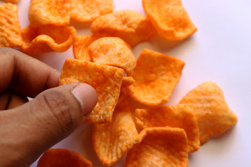 Orange snack made from fried wheat flour