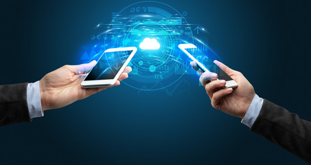Two mobile phones syncing through the cloud