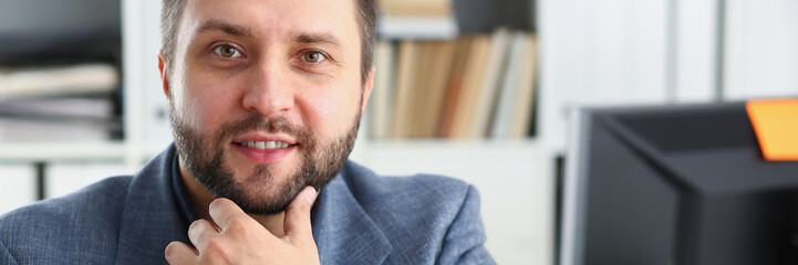 Fototapeta premium portrait of young handsome promising businessman in office