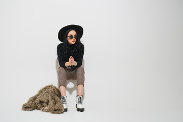 emotional woman posing on a light background. 
