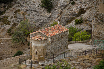 Little chapel and watchtower in the mountains. Christianity. A place for prayer.