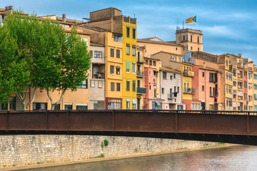 Fototapeta na wymiar Girona colorful houses district, buildings reflected in water in river Onyar. Catalonia Spain.