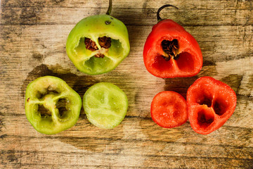 fresh rocoto chili ​​on a wooden board , copy space 