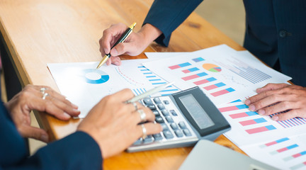 Business people discuss and analyze business strategies.