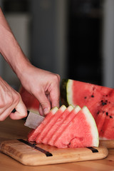 chop the watermelon with a knife. Sliced Watermelon. Without GMO. 