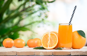 fresh orange juice with orange fruit outdoor table
