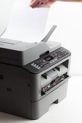 Hand press button on panel of printer. printer scanner laser office copy machine supplies start concept - Image
