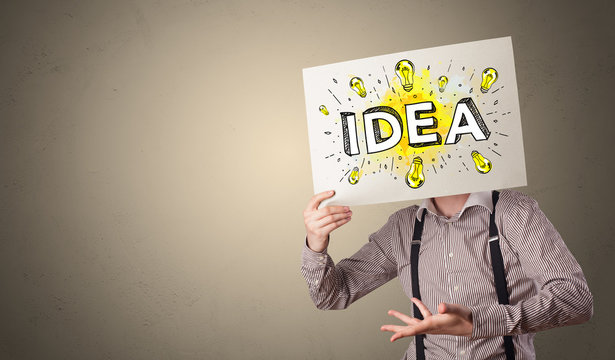 Young person holding white paper with new idea concept in front of his head