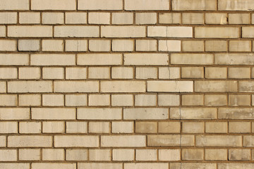 Partly renovated yellow brick work background wall texture