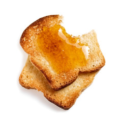 Two slices toasted bread covered with honey