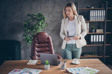 Photo of focused business woman readying to interview employee before accepting to job as a...