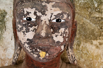 Weatherd face of buddha in Myanmar.