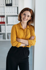 Relaxed friendly young woman office worker