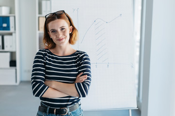 Confident modern young businesswoman in an office