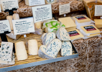 Selective focus of speciality and artisan cheeses for sale at the 2019 Christmas market at Chatsworth House