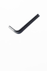 Hex key on white surface.