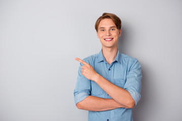 Portrait of confident cool guy promoter point index finger copypace pick tips ads promotion wear...