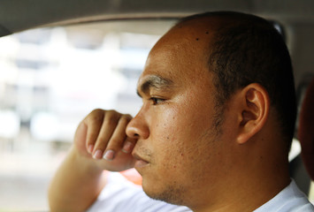 Fototapeta premium Close up man sadness in driving cars on the road.