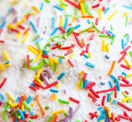 White icing with sprinkles on the cake