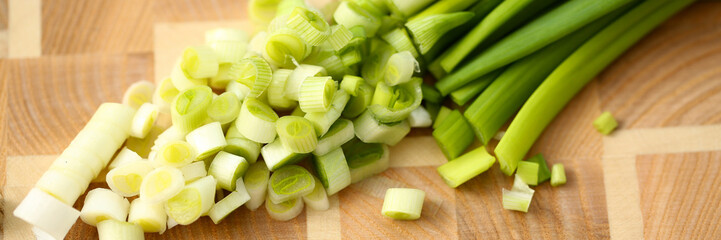 Cook holds knife in hand and cuts on