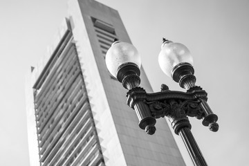 Lamp Post In Front of Tall Building