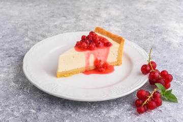 Modern cheese cake and red currant beeries