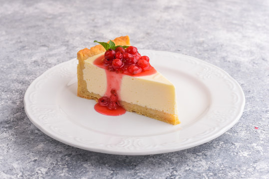 Modern cheese cake and red currant beeries