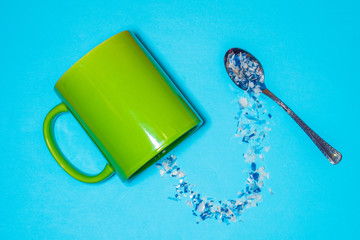 spoon and cup with microplastics
