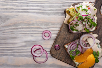 top view of fresh smorrebrod sandwiches on wooden surface