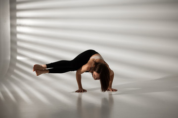 Young girl doing yoga, girl doing yoga exercises