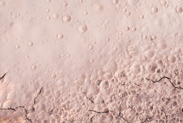 The ground is dry, water droplets and cracking.