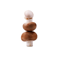 A tower of fresh brown mushrooms isolated on white background
